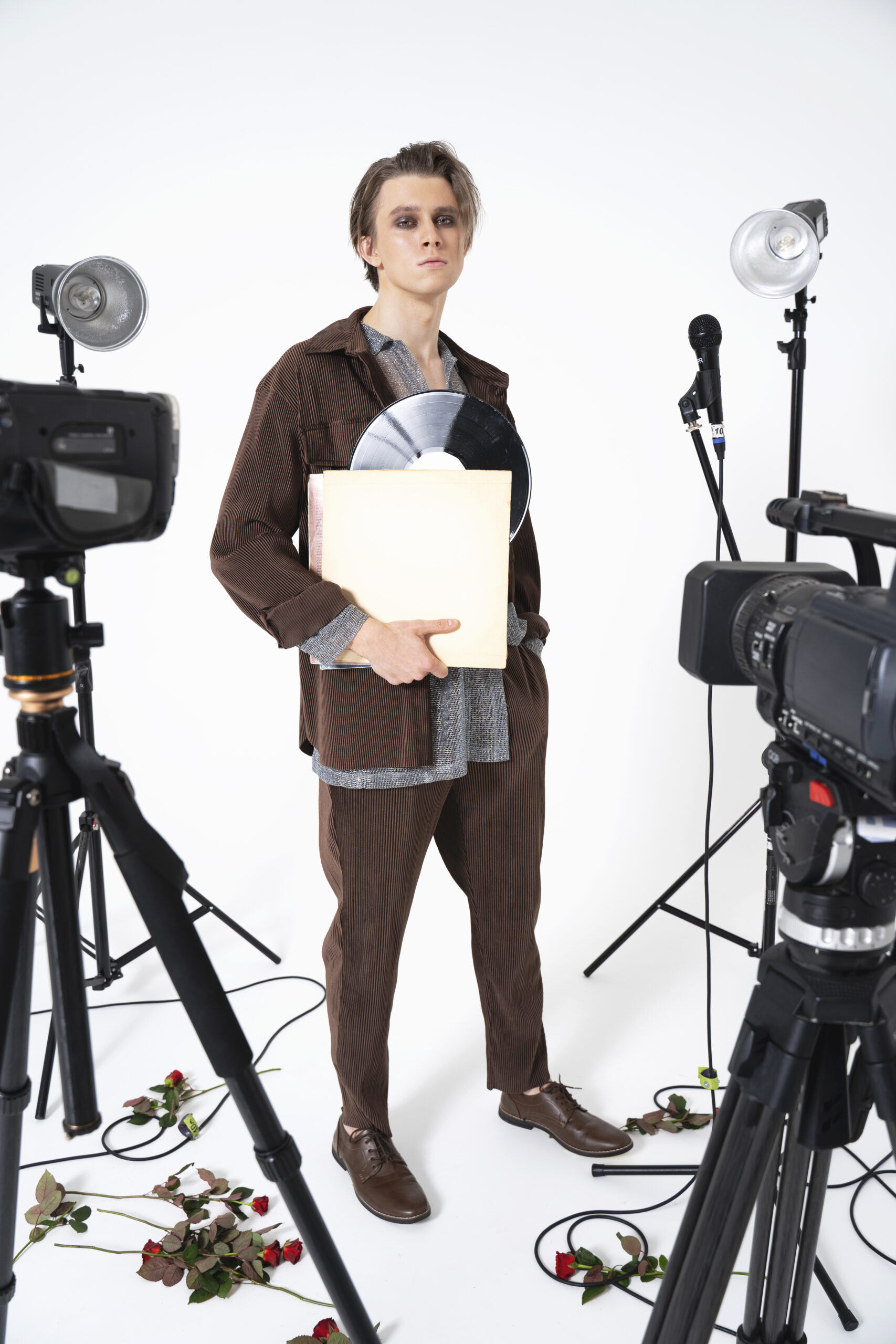 full-shot-man-holding-vinyl-record-scaled.jpg