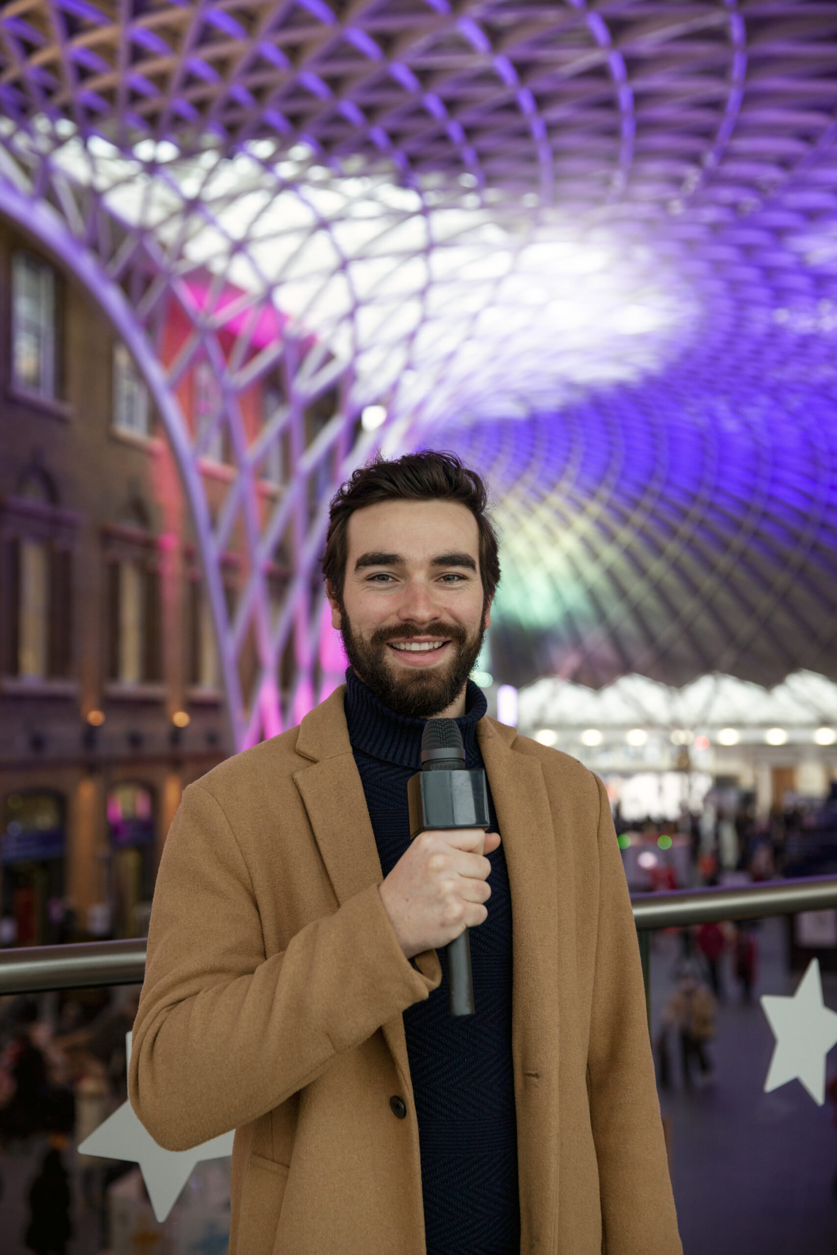 medium-shot-man-holding-microphone-scaled.jpg